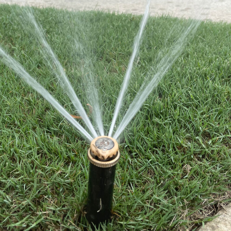 irrigation system watering a lawn